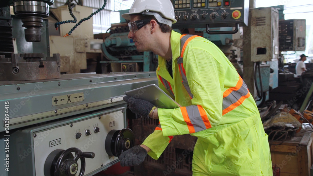 Smart factory worker using machine in factory workshop . Industry and engineering concept.