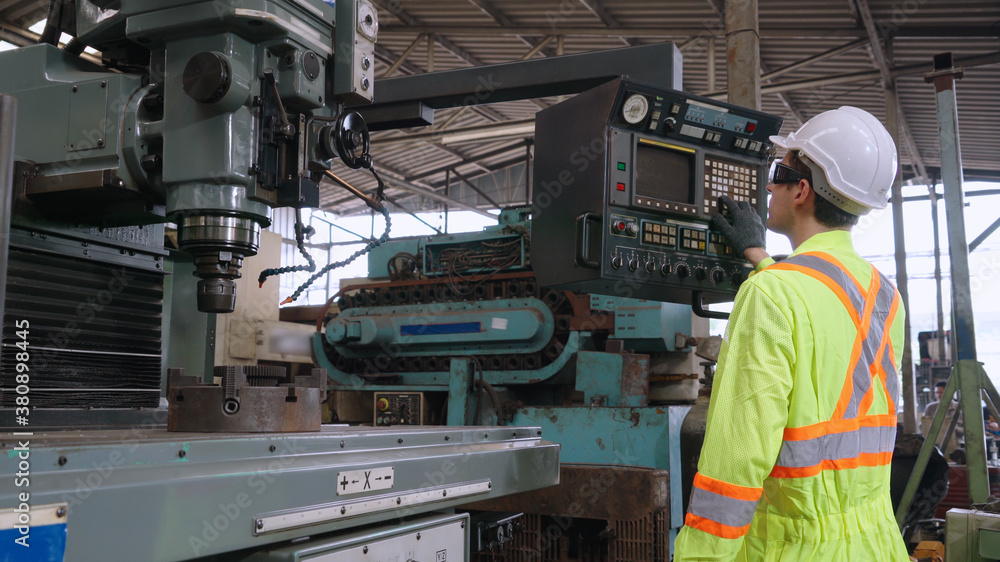 Smart factory worker using machine in factory workshop . Industry and engineering concept.