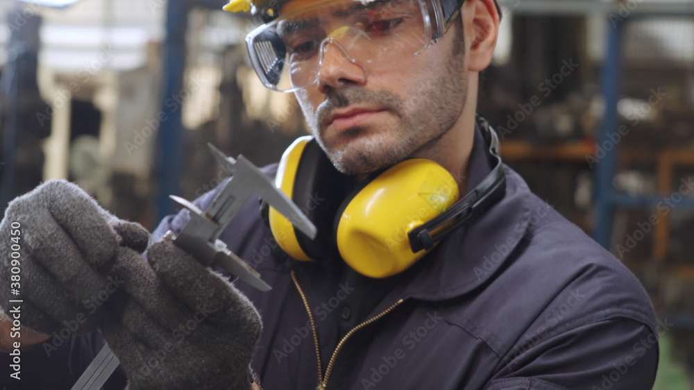 Smart factory worker using machine in factory workshop . Industry and engineering concept.