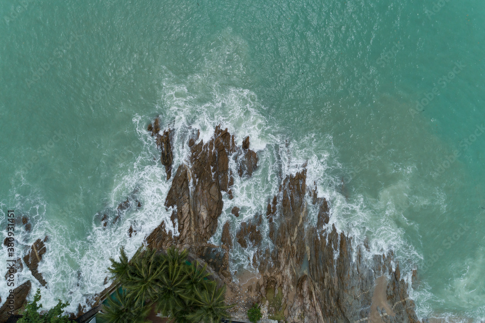 Aerial view of crashing waves on rocks landscape nature view and Beautiful tropical sea with Sea coa