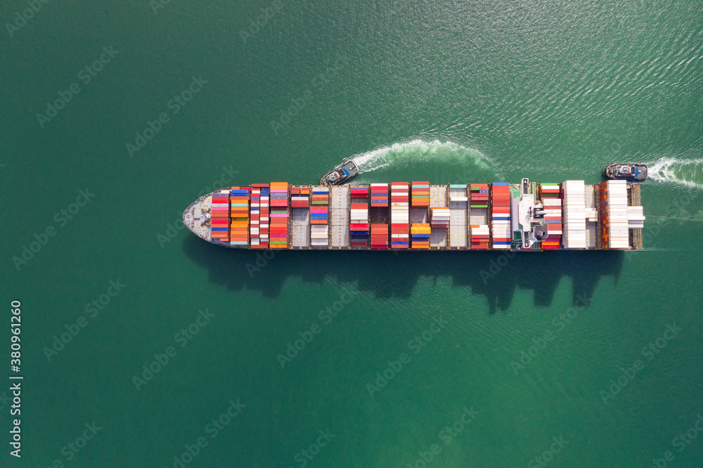 Container , container ship in export and import business and logistics. Shipping cargo to harbor by 