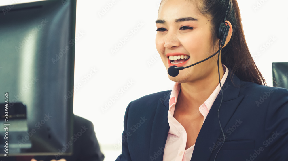 Business people wearing headset working in office to support remote customer or colleague. Call cent