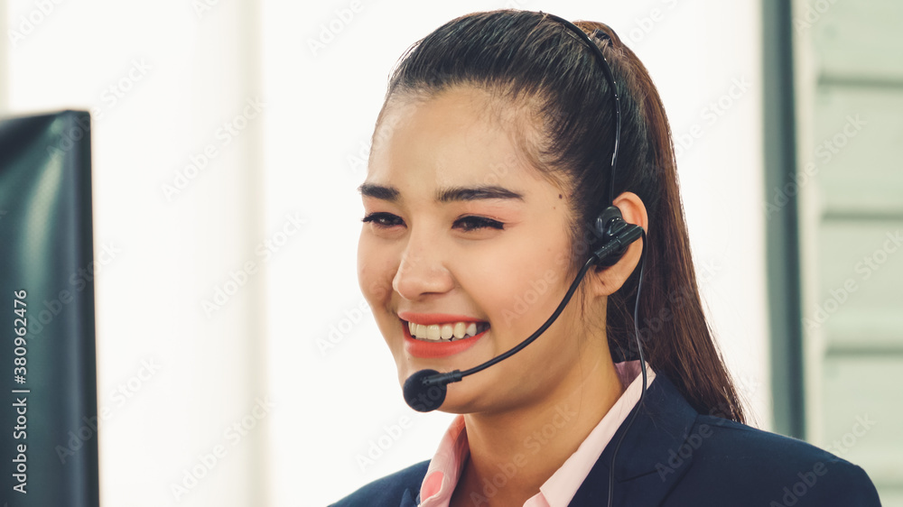 Business people wearing headset working in office to support remote customer or colleague. Call cent