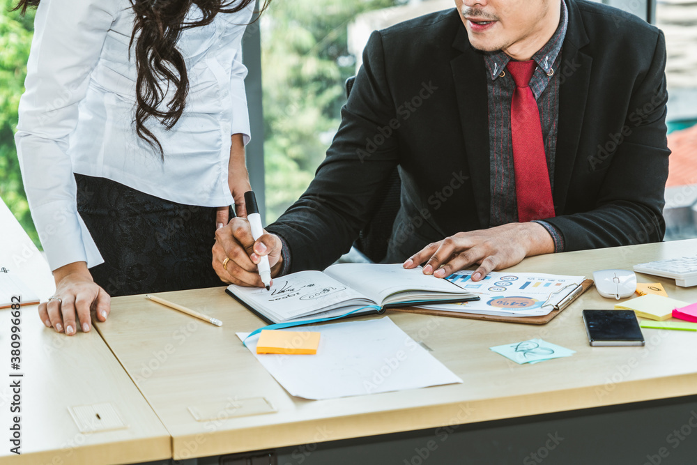 Two business people talk project strategy at office meeting room. Businessman discuss project planni