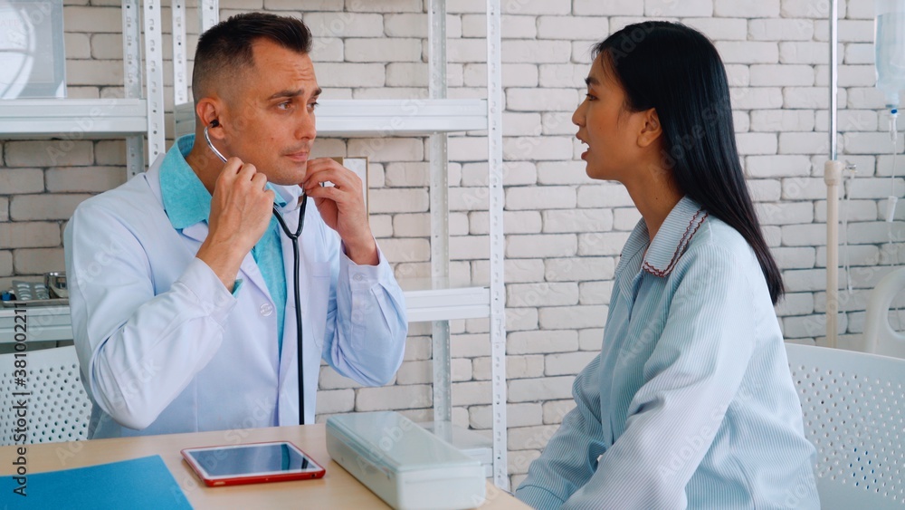 Doctor in professional uniform examining patient at hospital or medical clinic. Health care , medica