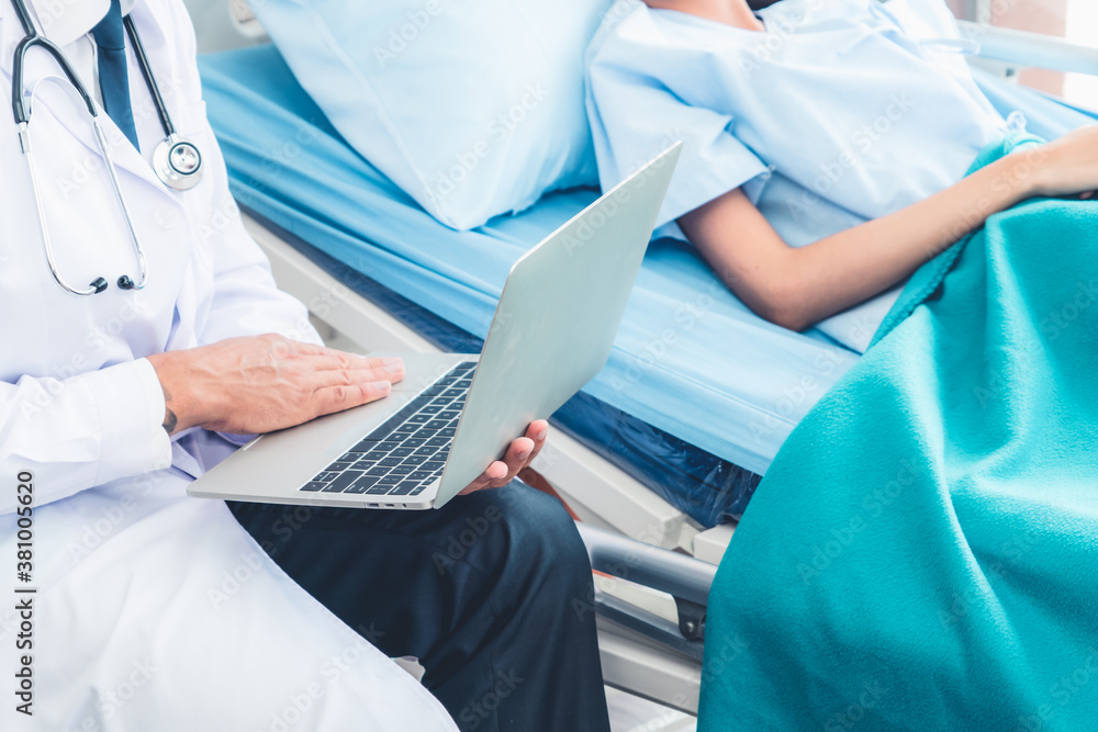 Doctor in professional uniform examining patient at hospital or medical clinic. Health care , medica