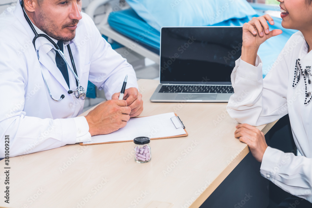 Doctor in professional uniform examining patient at hospital or medical clinic. Health care , medica