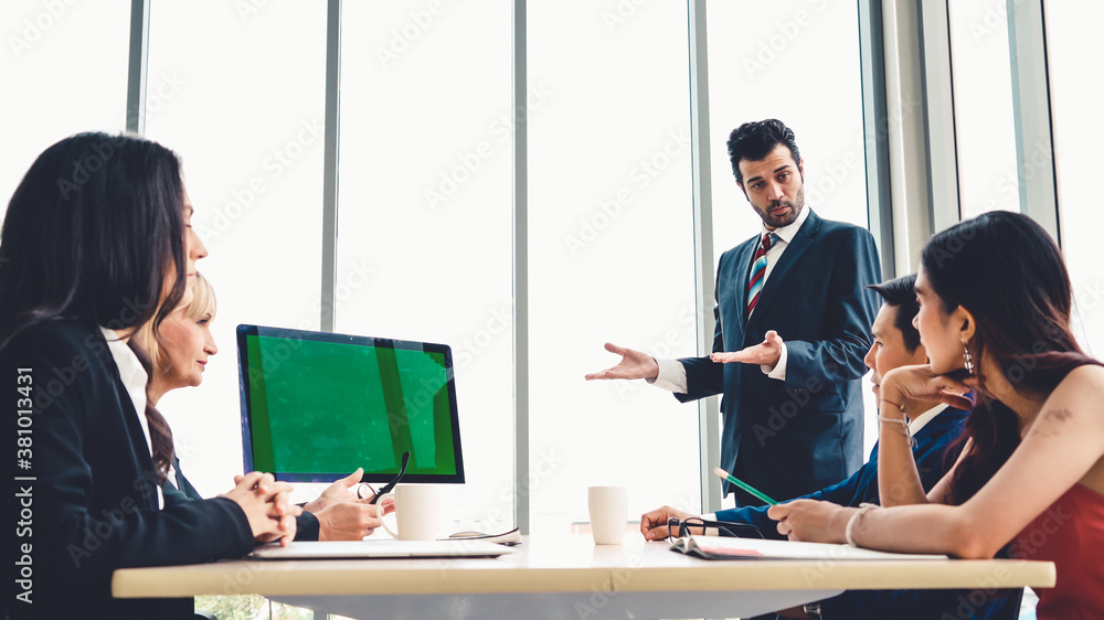 Business people in the conference room with green screen chroma key TV or computer on the office tab