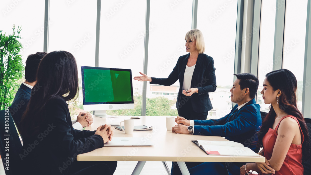 Business people in the conference room with green screen chroma key TV or computer on the office tab