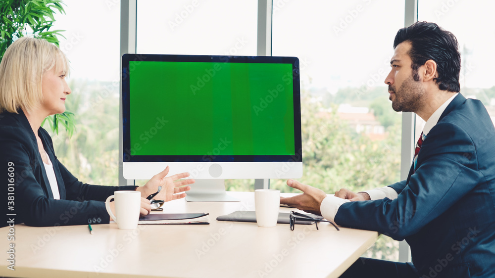 Business people in the conference room with green screen chroma key TV or computer on the office tab