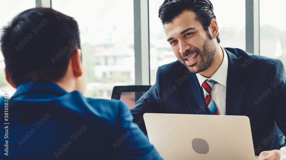 Job seeker in job interview meeting with manager and interviewer at corporate office. The young inte