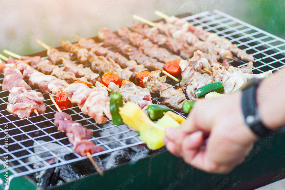 Delicious BBQ steak roasted on the charcoal grill.