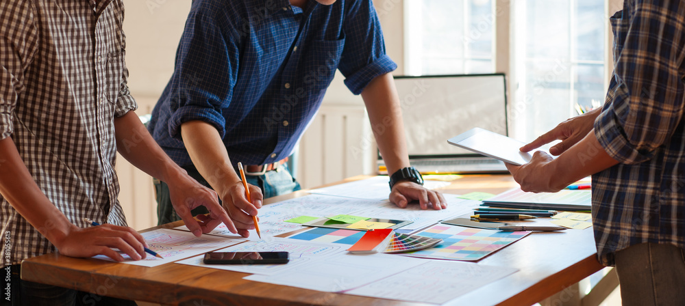 Design groups brainstorm their creativity to draw and design website and app layouts.