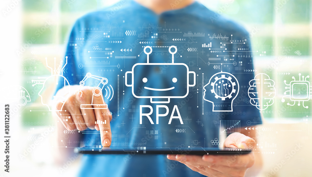 Robotic Process Automation RPA theme with young man using a tablet computer