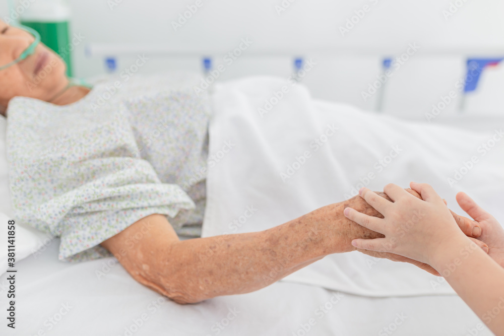 hand in hand, children holding hand of old patient in hospital, she visiting grandmother, elderly he