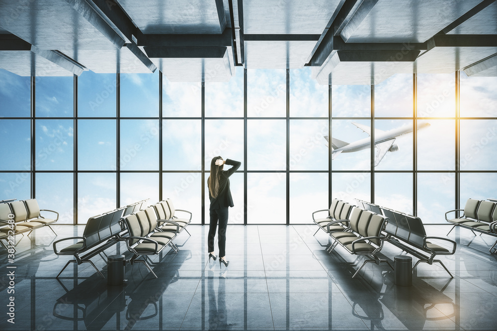 Businesswoman standing in modern airport