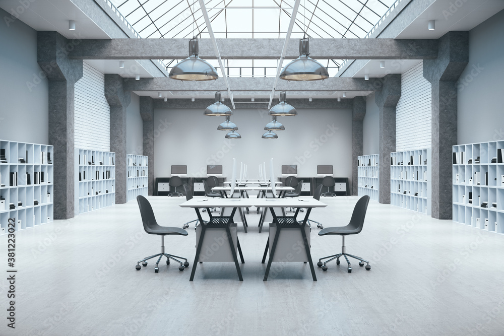 Luxury coworking office in loft style and table with computers.