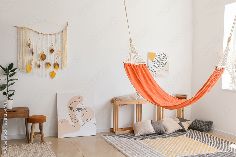 Interior of living room with stylish hammock