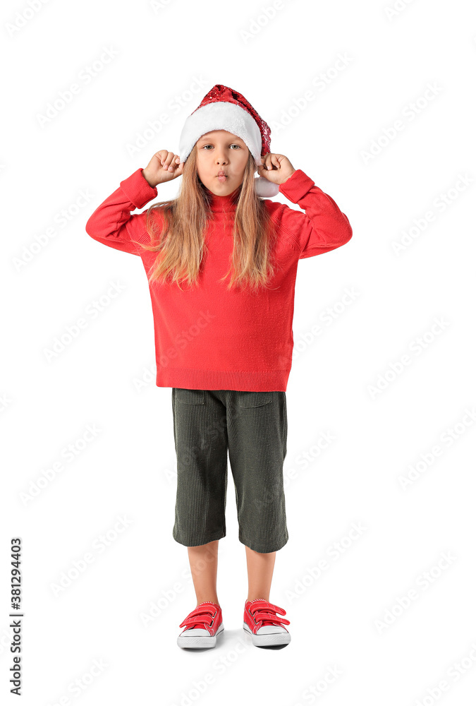 Funny little girl in Santa Claus hat on white background