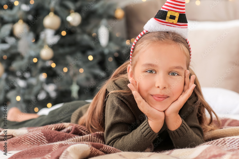 Cute little girl at home on Christmas eve