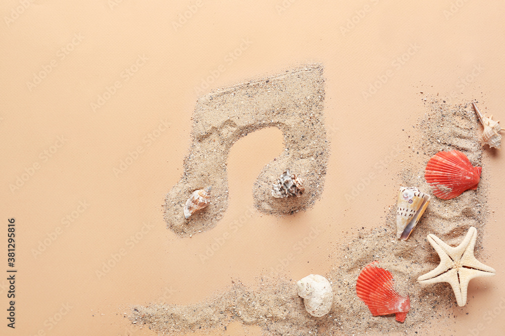 Music note made of sea sand and shells on color background