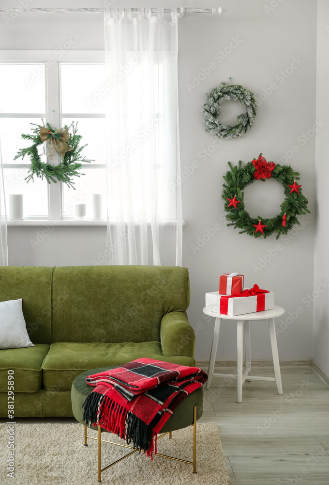 Beautiful Christmas wreaths in interior of room