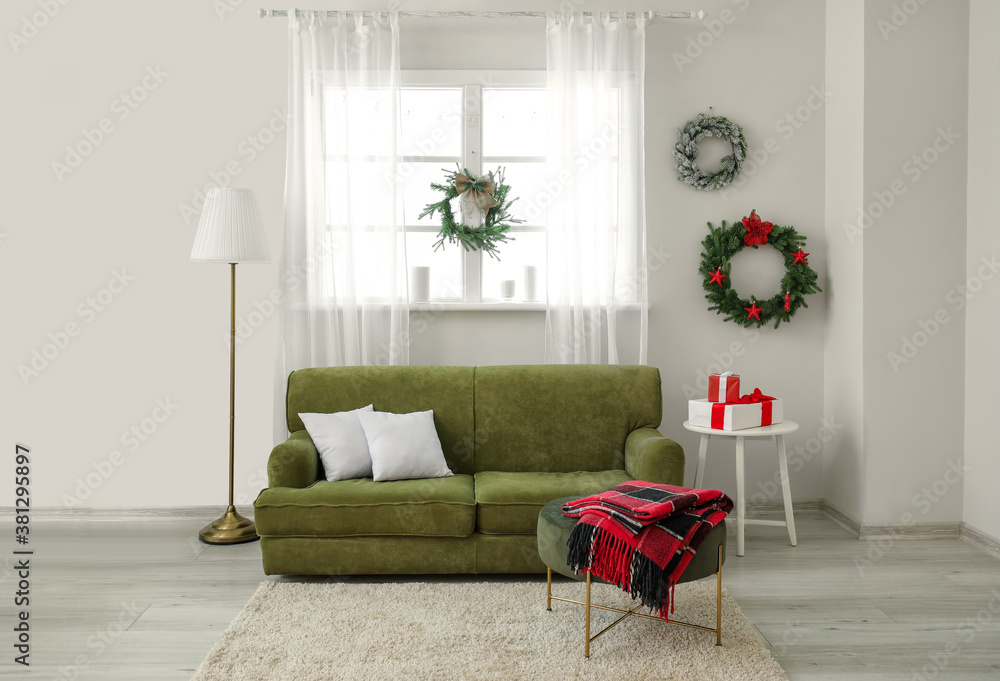 Beautiful Christmas wreaths in interior of room