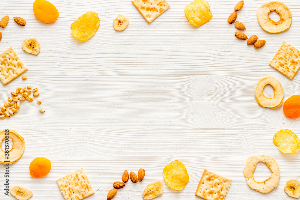 Frame of nuts overhead with dried fruits and other snacks top view