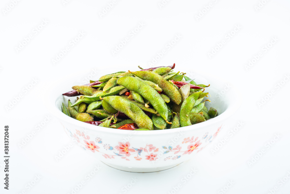 A pot of delicious spicy edamame on white background