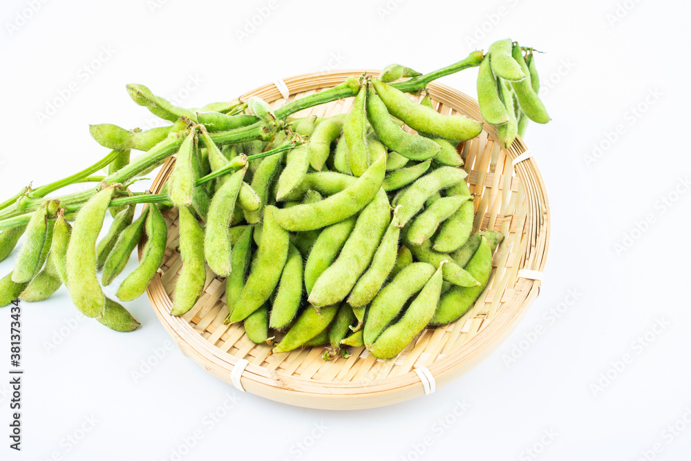 Fresh edamame in a pot on white background