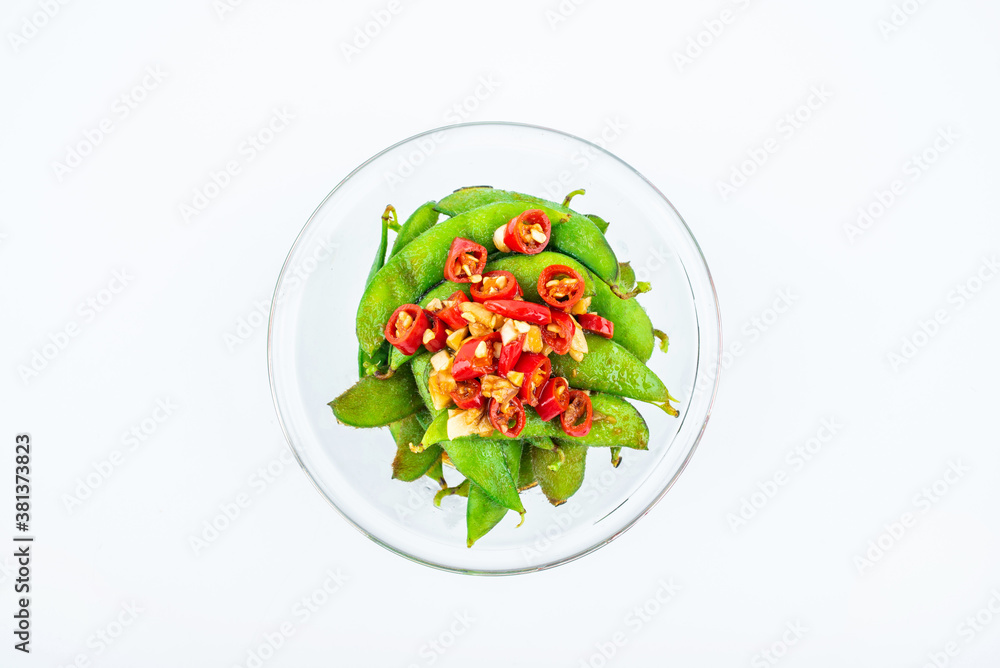 A plate of delicious cold edamame on white background