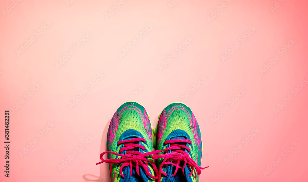 Pair of sport shoes with pink laces - flat lay