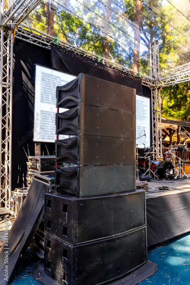 Speakers, sound system for concert. Set of powerful speakers near stage.