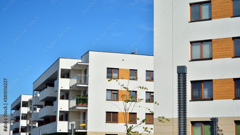 Futuristic square architecture of apartment building for real estate with big windows.