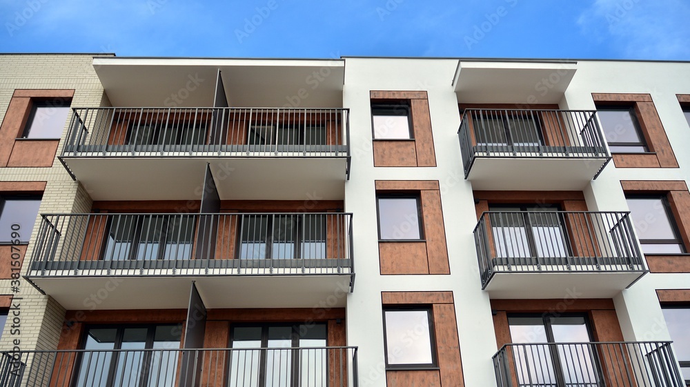 Futuristic square architecture of apartment building for real estate with big windows.