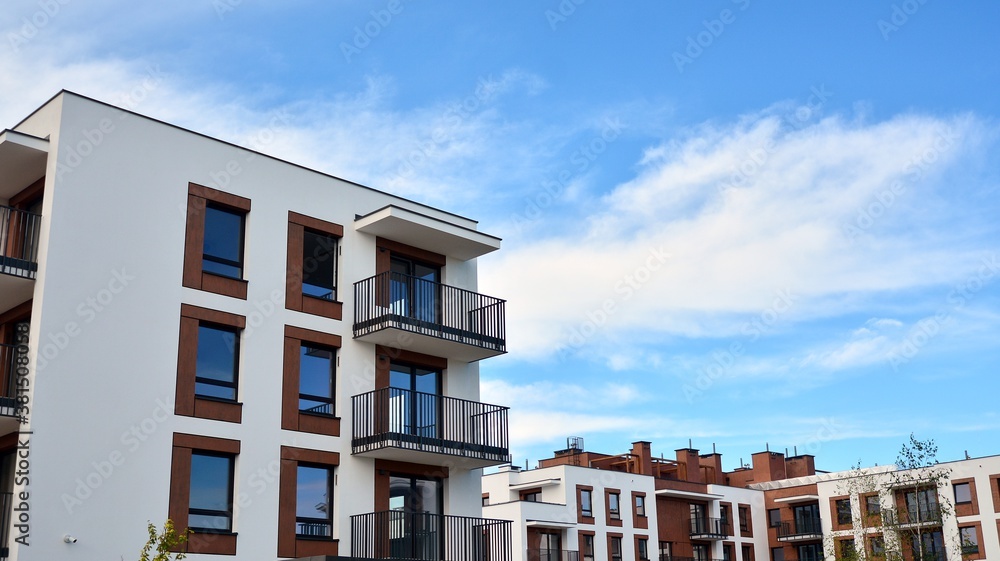 Futuristic square architecture of apartment building for real estate with big windows.