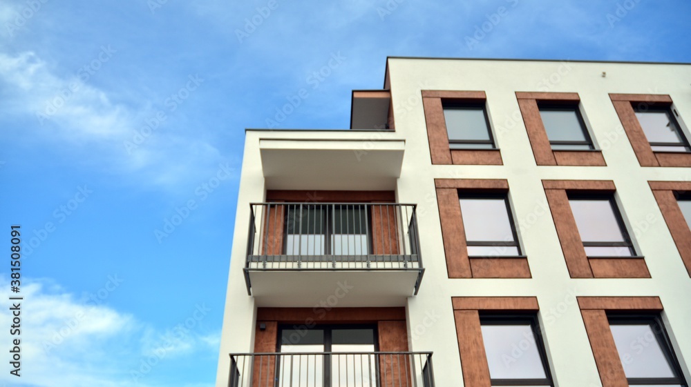 Futuristic square architecture of apartment building for real estate with big windows.