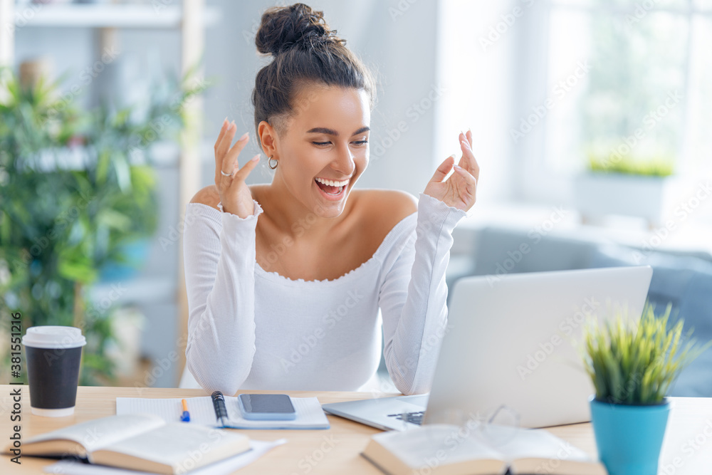 woman working on laptop at home.