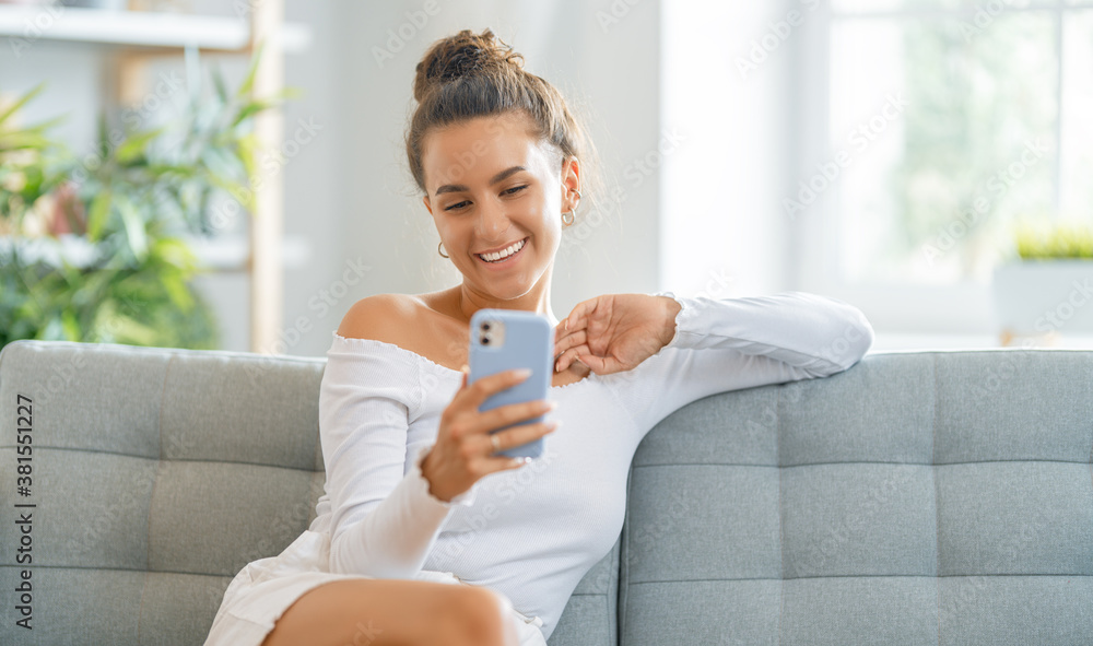 Young woman is using phone for video call