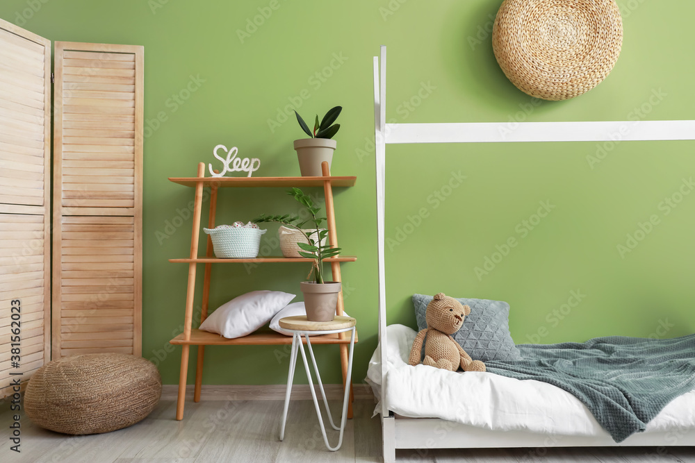 Interior of modern childrens room with comfortable bed