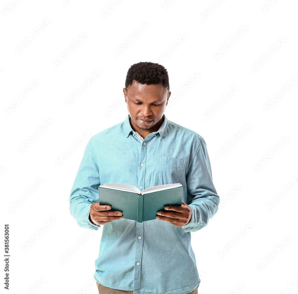 African-American man reading book on white background