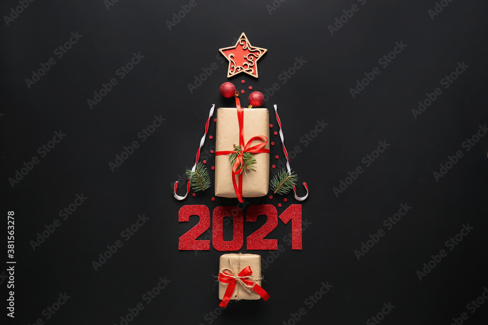 Christmas tree made of New Year decor on dark background