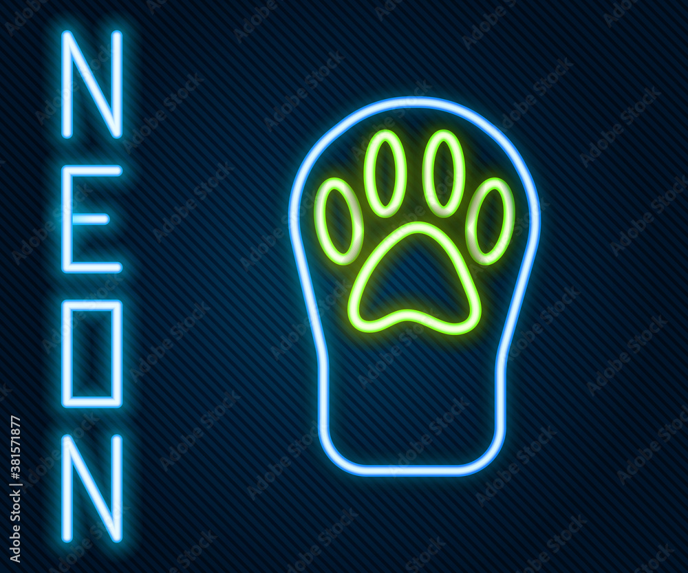 Glowing neon line Paw print icon isolated on black background. Dog or cat paw print. Animal track. C