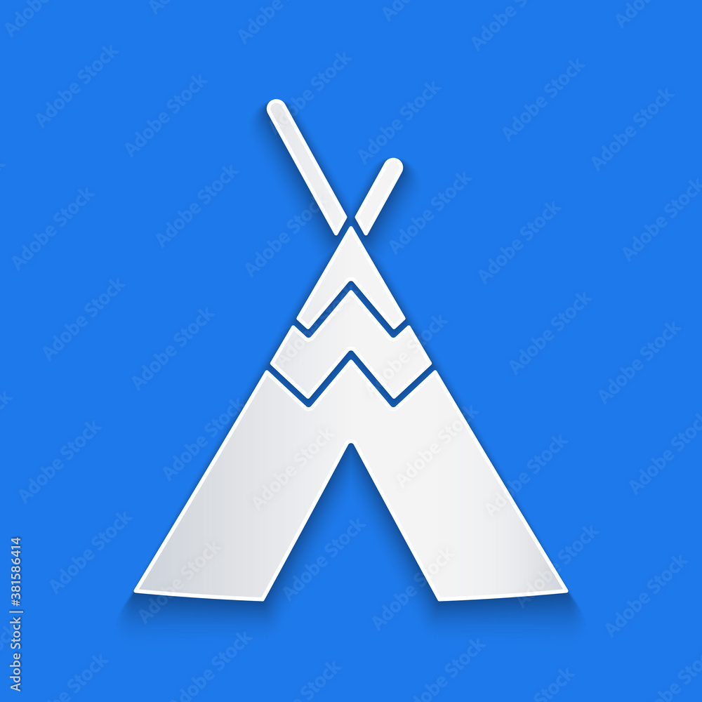 Paper cut Traditional indian teepee or wigwam icon isolated on blue background. Indian tent. Paper a