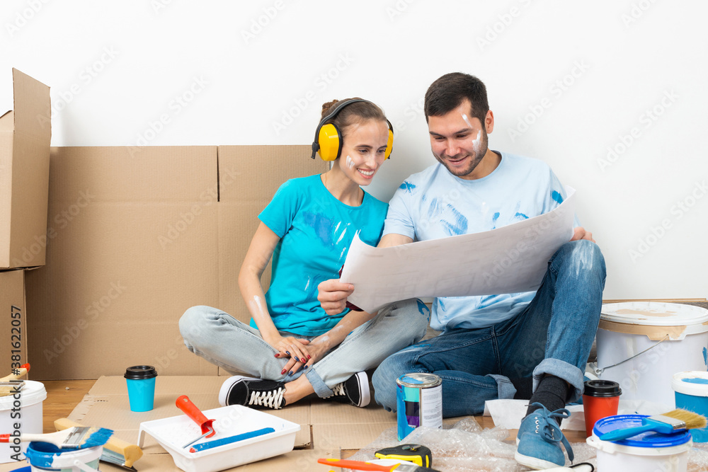 Happy boy and girl in protective headphones