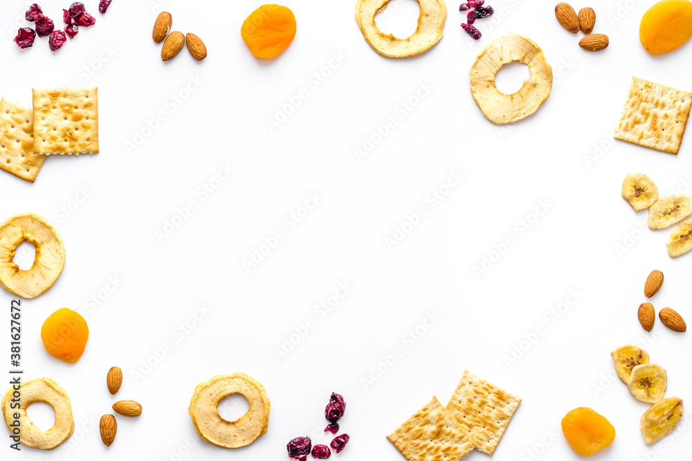 Frame of nuts overhead with dried fruits and other snacks top view