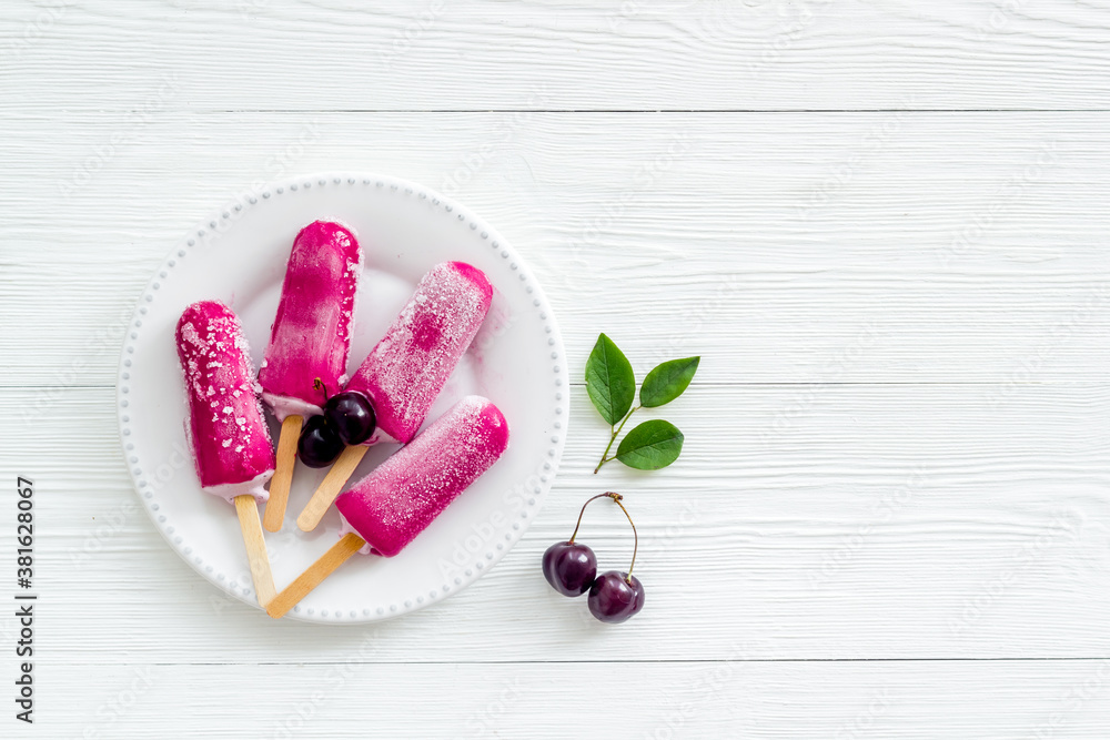 Cherry ice cream popsicles, top view, copy space