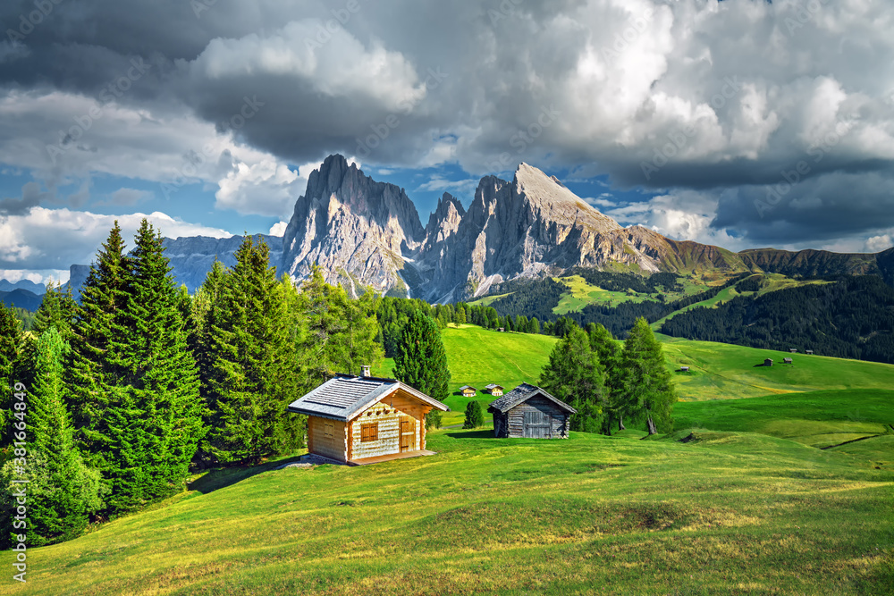 Famous Alpe di Siusi - Seiser Alm with Sassolungo - Langkofel mountain group in background at sunset