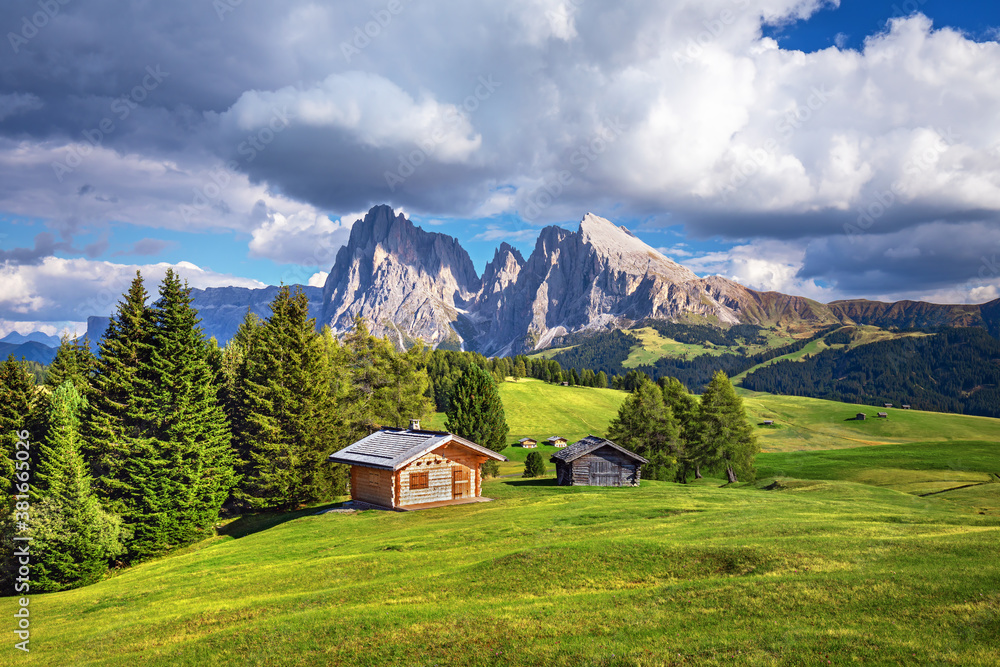 Famous Alpe di Siusi - Seiser Alm with Sassolungo - Langkofel mountain group in background at sunset