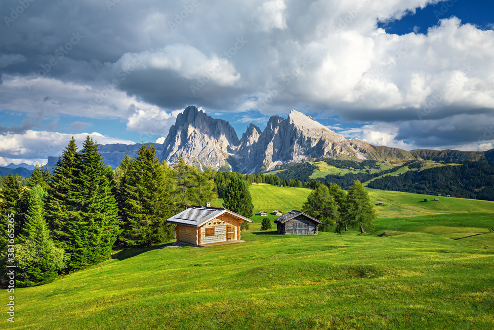 Famous Alpe di Siusi - Seiser Alm with Sassolungo - Langkofel mountain group in background at sunset